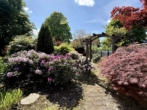 Garten - Charmantes freistehendes Einfamilienhaus mit Wintergarten und großem Gartenparadies in ruhiger Lage