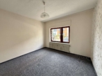 Schlafzimmer EG - Charmantes 2-Familien-Reihenendhaus mit Potenzial – Auch als Einfamilienhaus nutzbar!
